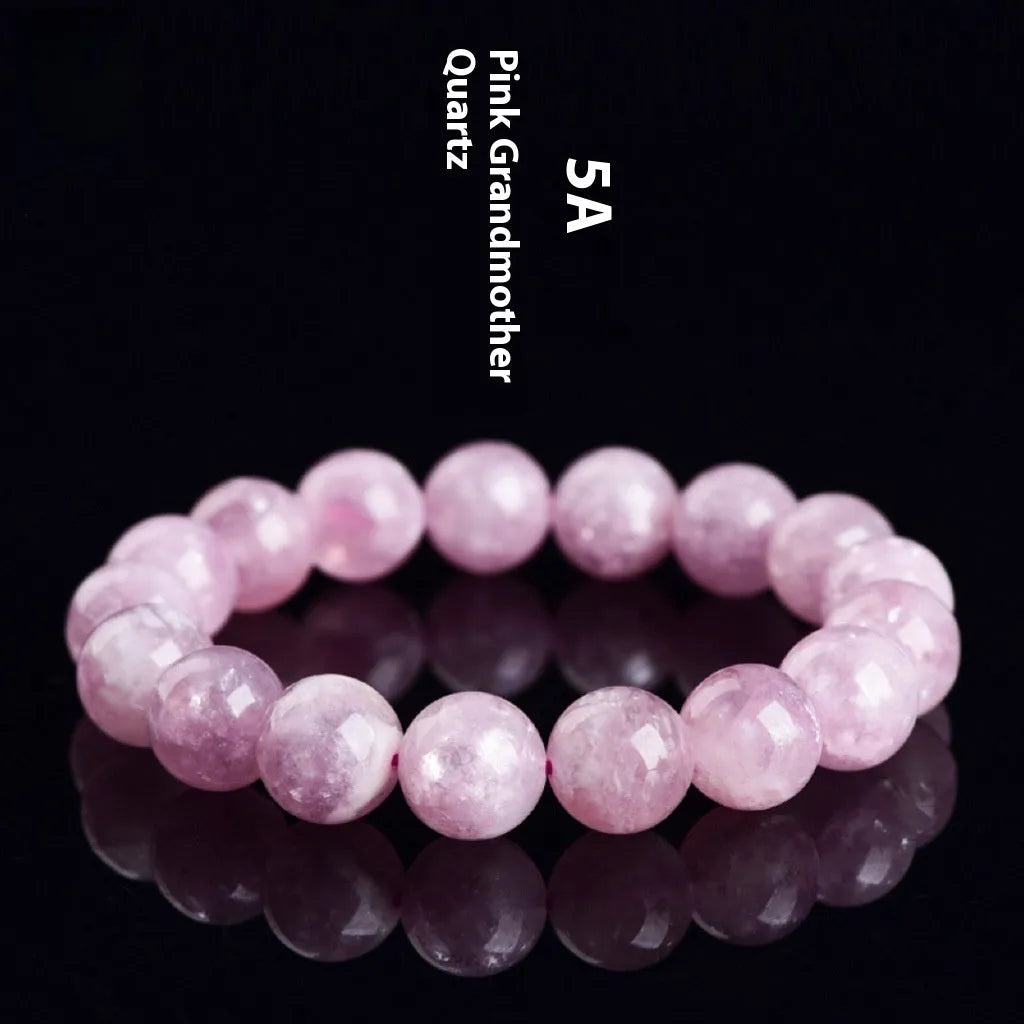 Purple polished crystal beaded bracelet with geometric beads on a white background.