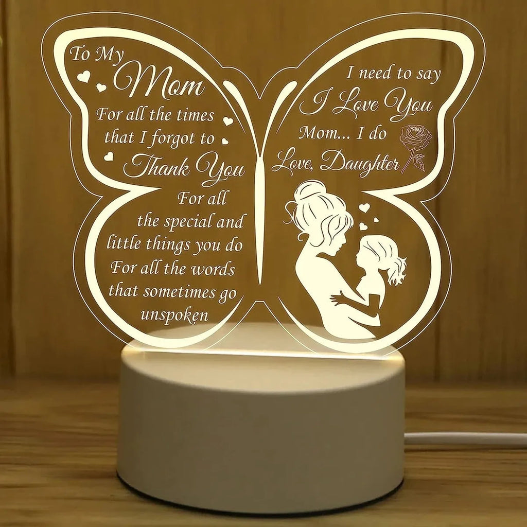 White heart-shaped USB table lamp with touch switch on a wooden surface.