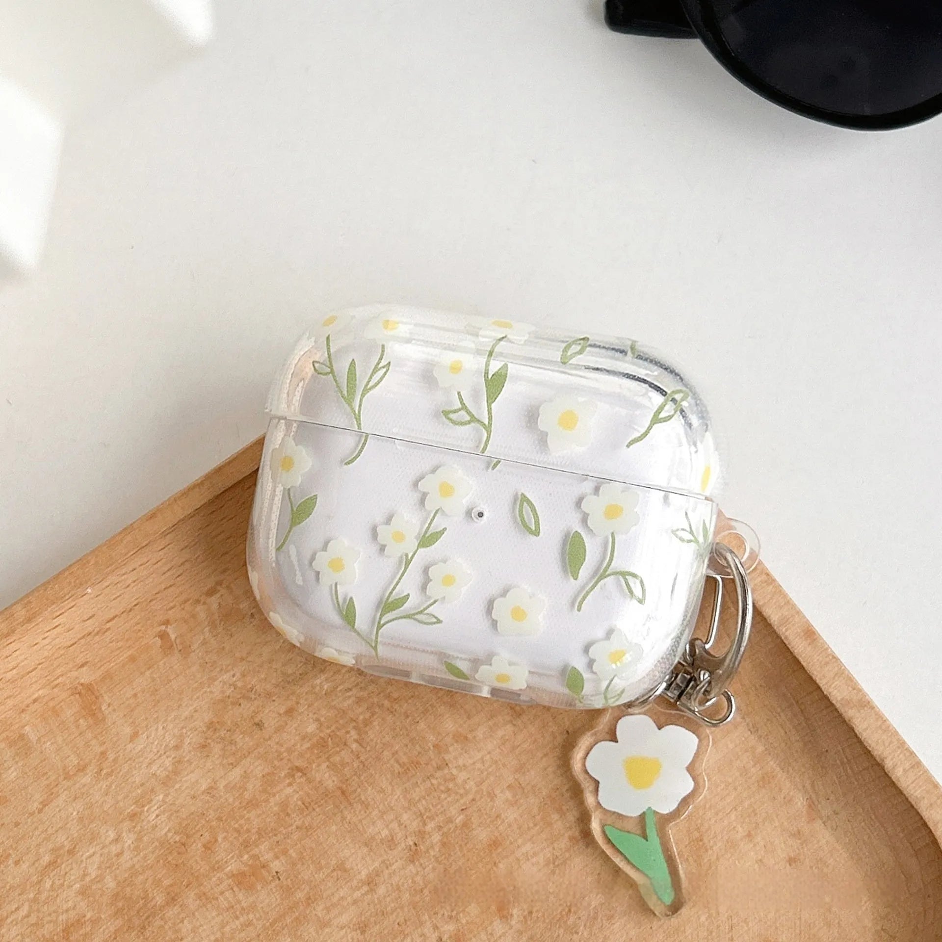 Clear TPU protective case with white floral pattern for Apple AirPods charging case