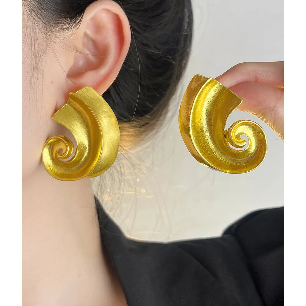Geometric retro design ear studs in gold and silver colours measuring 5cm