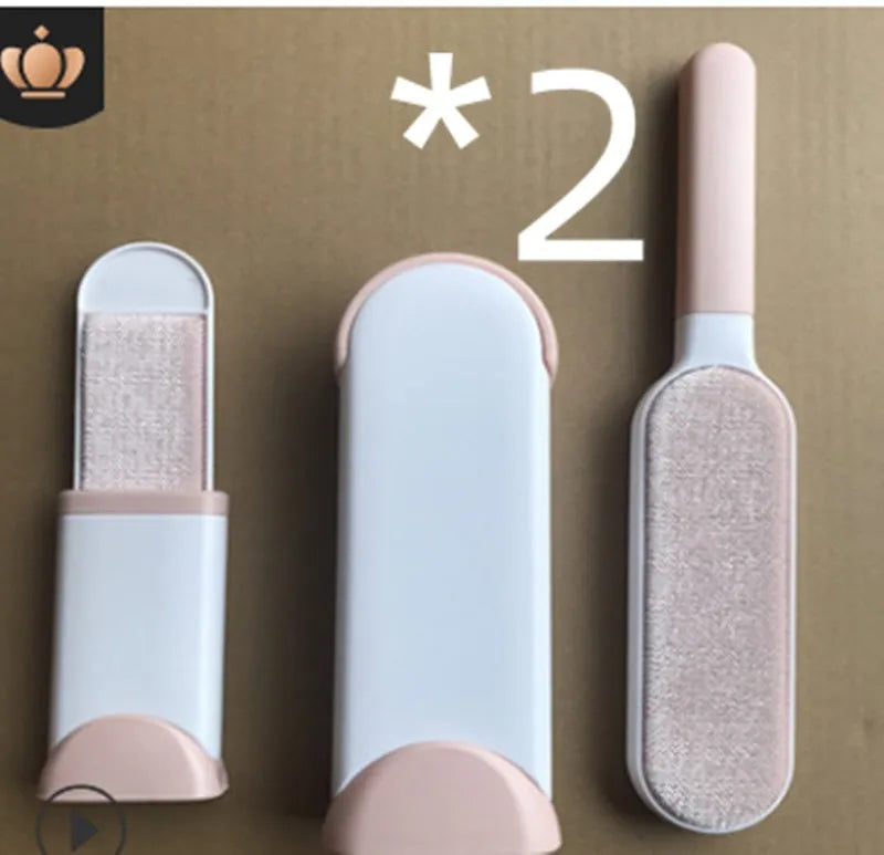 Blue reusable pet hair removal brush with a self-cleaning base, placed on a grey sofa.