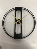 Large round metal wall clock with a 50cm diameter in a black finish on a white wall.