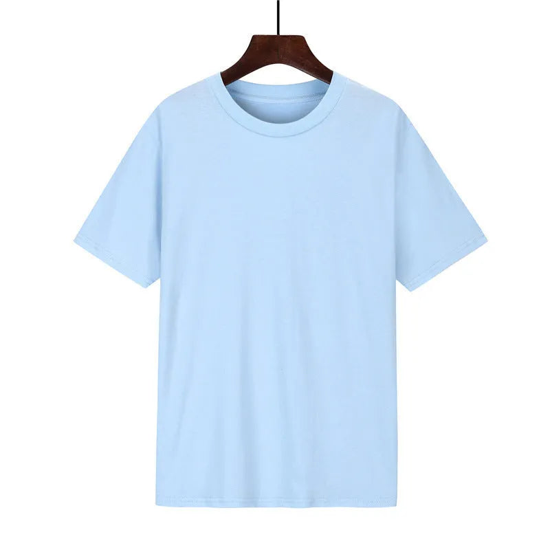 Man wearing a black loose-fit cotton T-shirt with short sleeves, showcasing casual style.