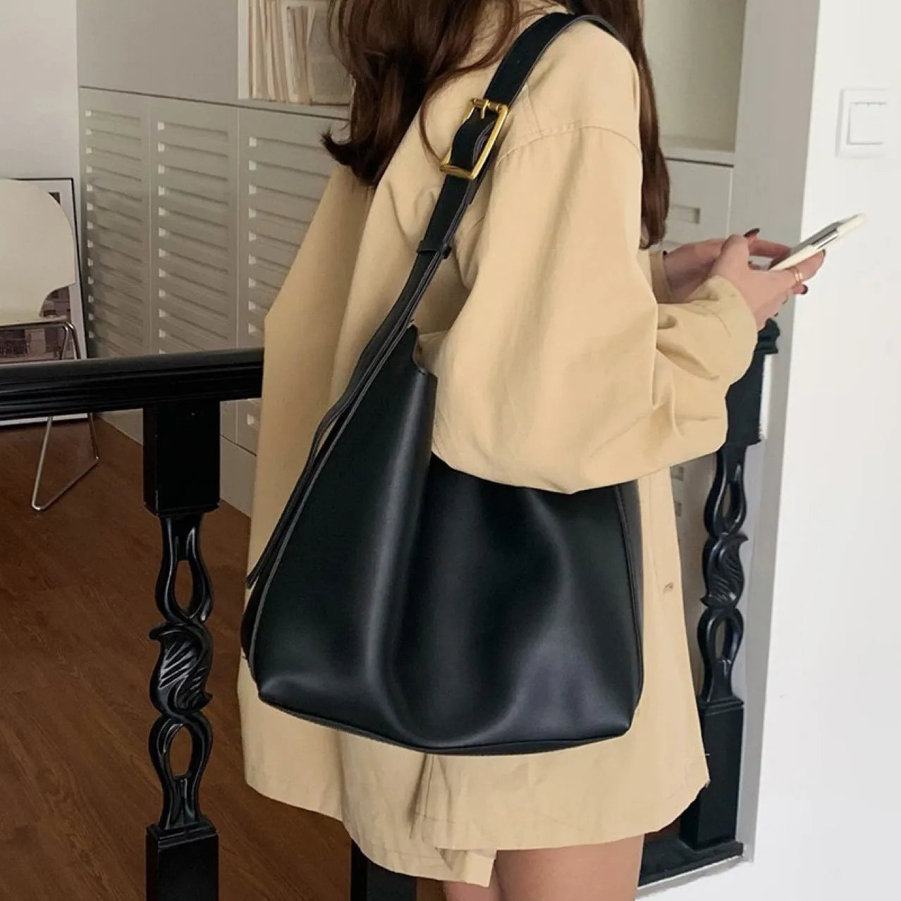 Women's black and brown shoulder bags with swinging threads and soft PU leather construction