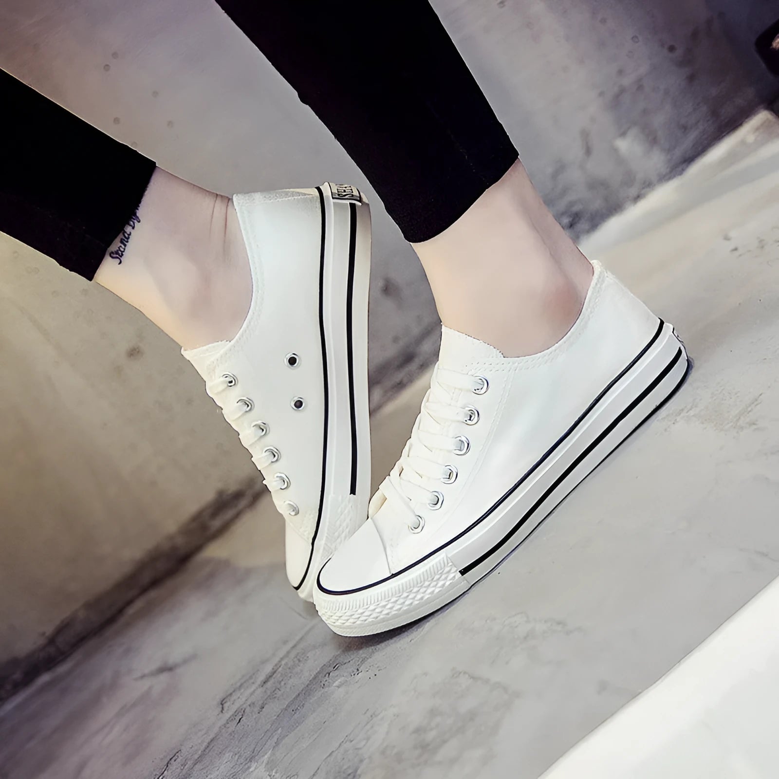 Solid colour women's canvas lace-up flats in black, shown on a white background.