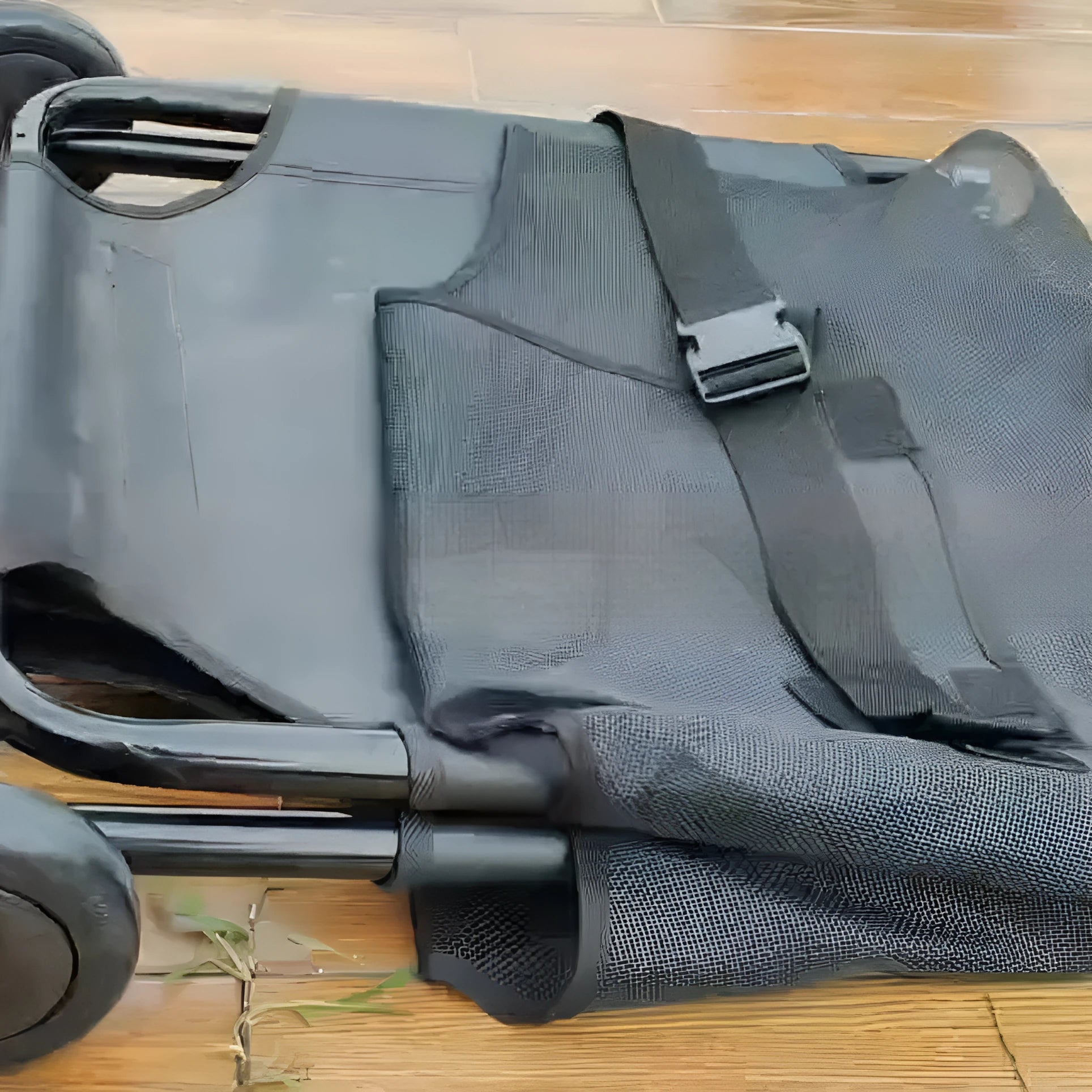 Large black foldable aluminium pet stretcher for emergency dog transport with collapsed frame