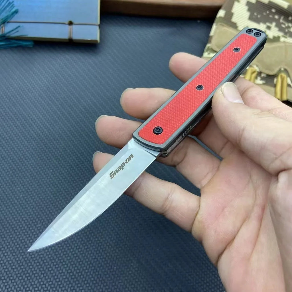 Folding fruit knife with stainless steel blade in black, brown, or red handle colours