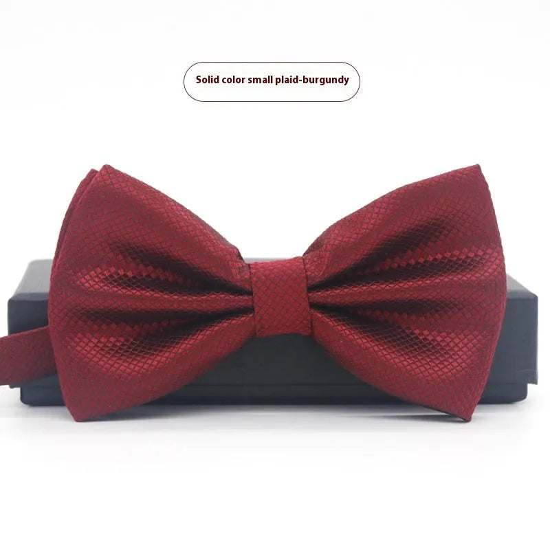 Men's flat head style polyester bow tie in a solid colour, shown with adjustable neck strap.
