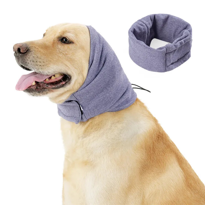 Dog wearing black calming hoodie head cover with ear wrap for noise reduction