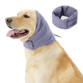 Dog wearing black calming hoodie head cover with ear wrap for noise reduction