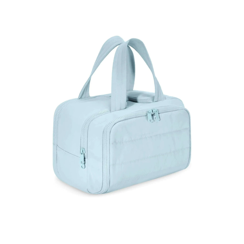 Large lightweight travel wash bag in beige colour with wide-opening design showing interior space