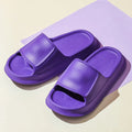 Soft EVA flip-flop slippers with thick sole in multiple colours on a white background.