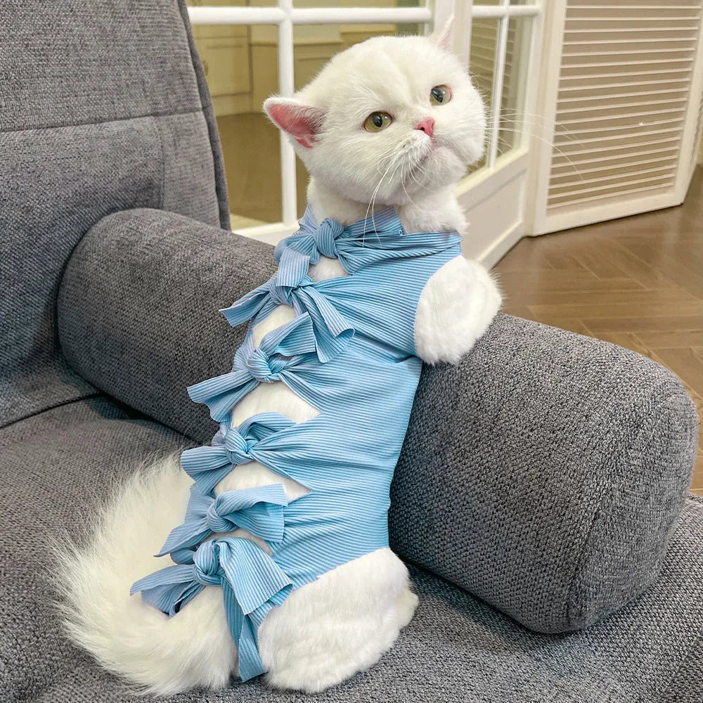 Adjustable lace-up cat sterilisation recovery suit in polyester, shown in various colours.