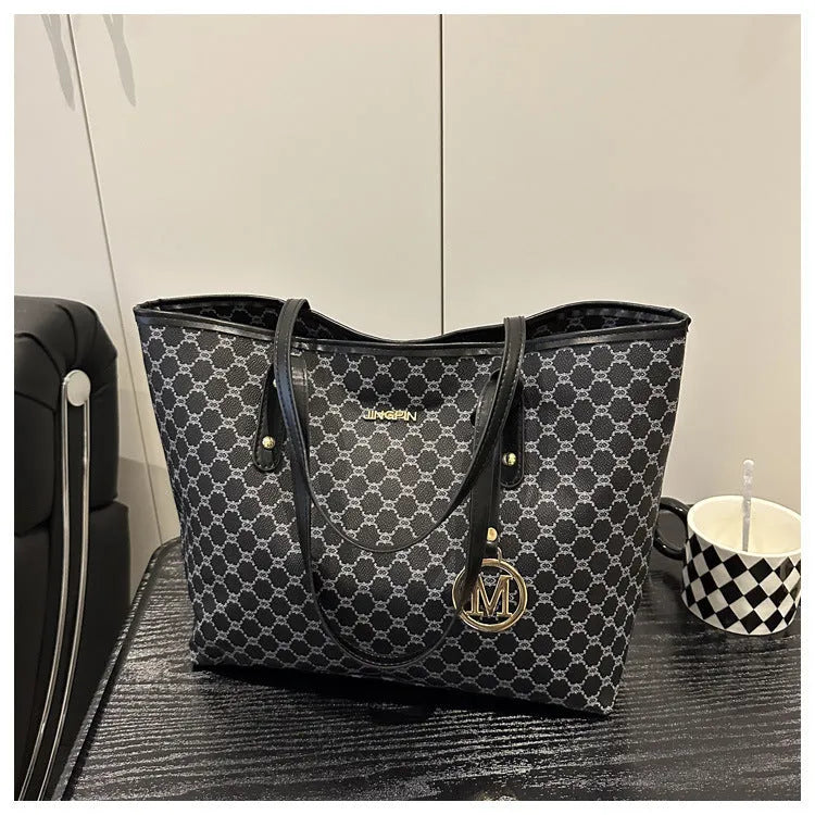 Street trend western style shoulder bag in PU material with sewn detailing, shown in black.