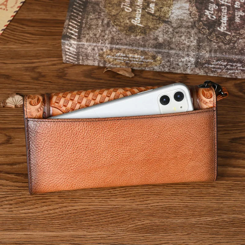 Women's retro brown tri-fold leather wallet with an embossed Chinese floral pattern, shown open.