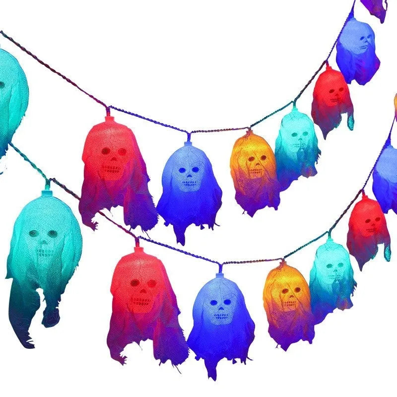Halloween battery-powered coloured LED string lights on a plastic spool with battery box, options for 1.5m or 2.5m length.