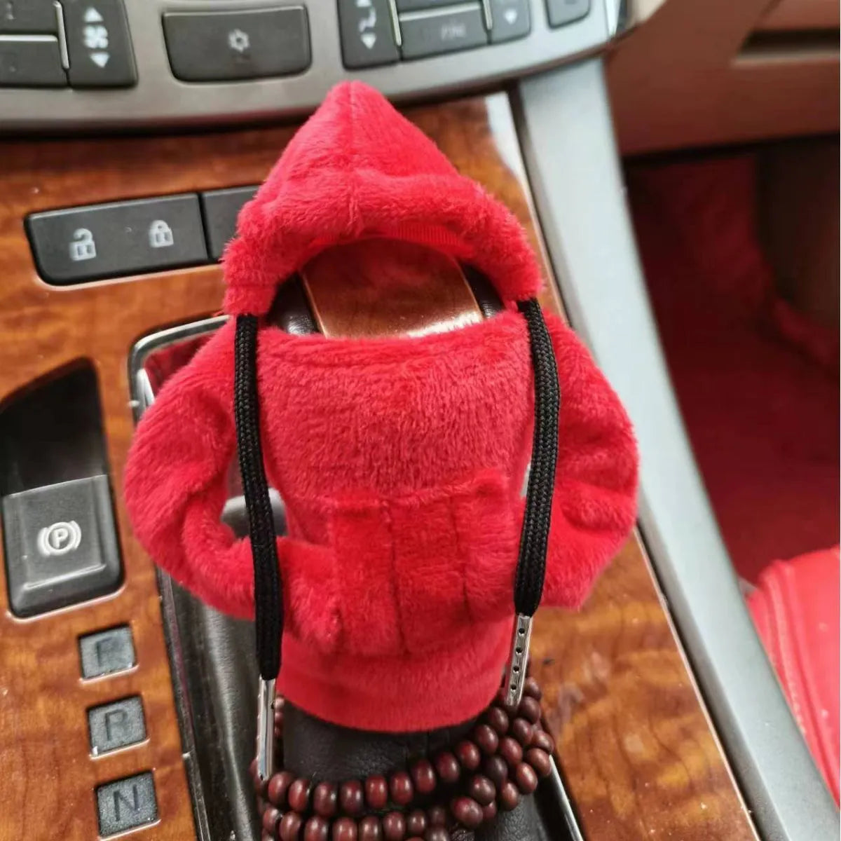 Dutch velvet car gear handle sleeve cover in multiple colours on a car gear lever.