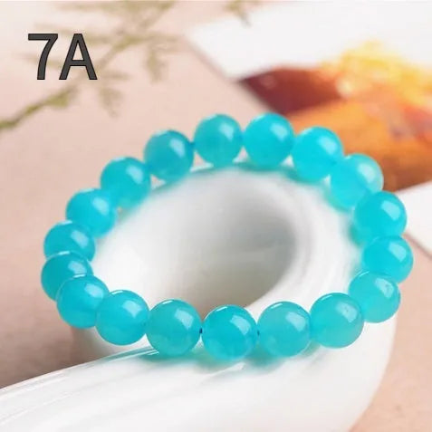 Natural amazonite scattered beads in ice colour with polished surfaces, showing single circle and three ring styles