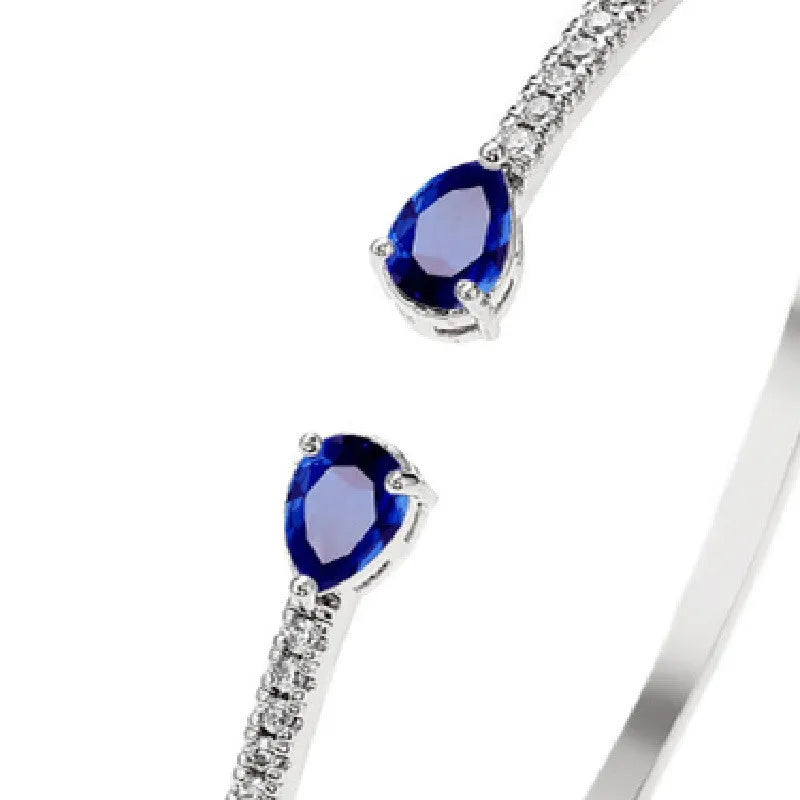 Copper bracelet with inlaid zircon treatment in blue and white colour options