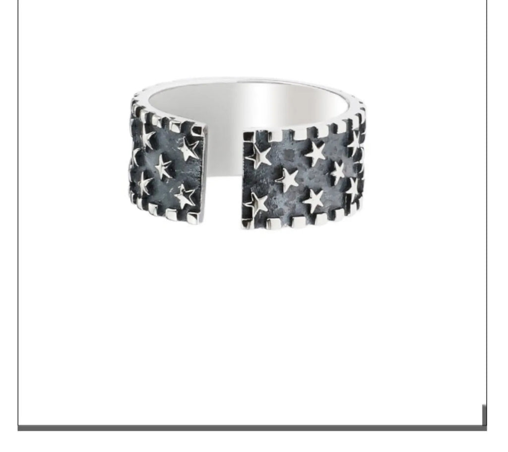 Sterling silver ring with five-pointed star design and adjustable opening