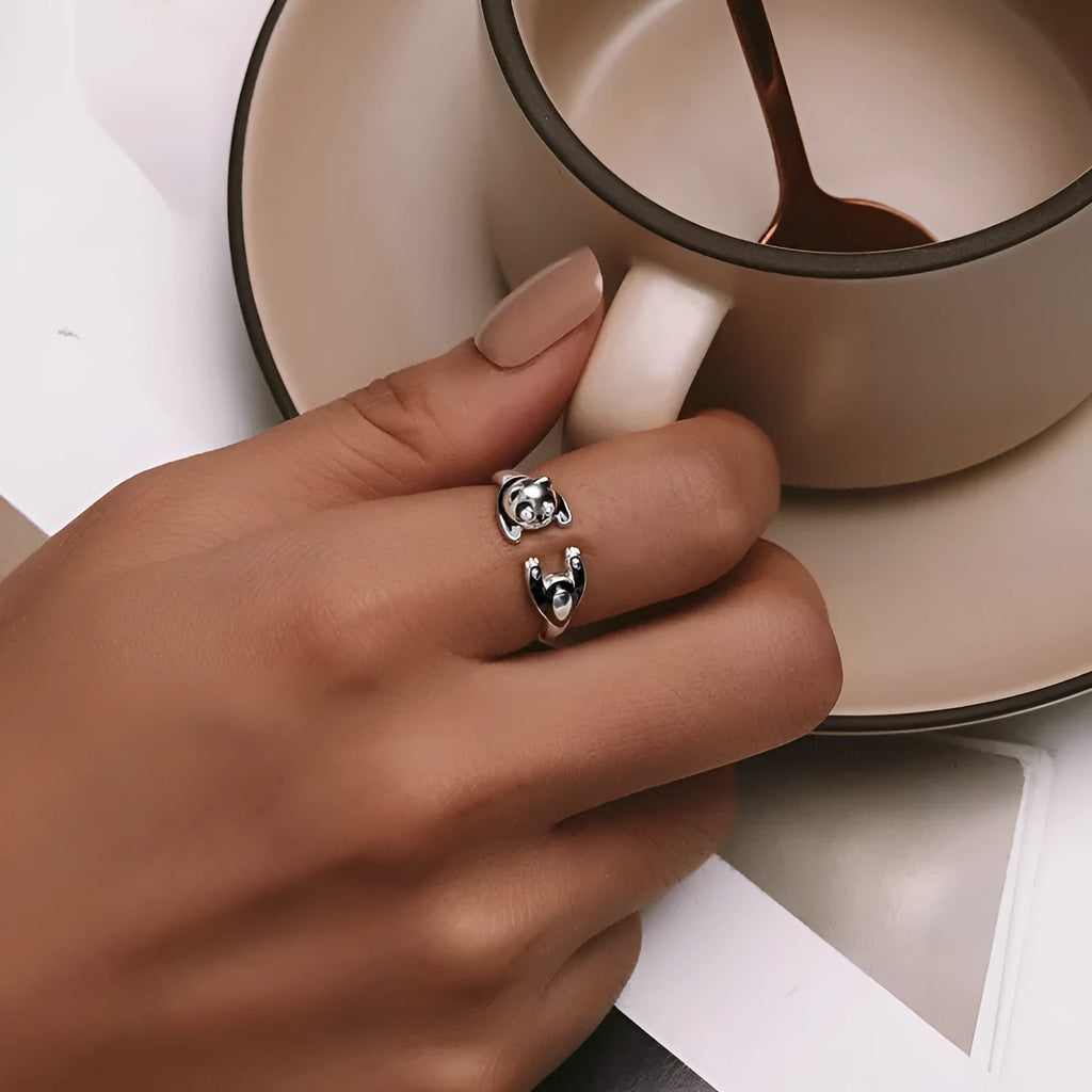 Adjustable sterling silver panda ring bracelet with white gold plating and drip oil finish.