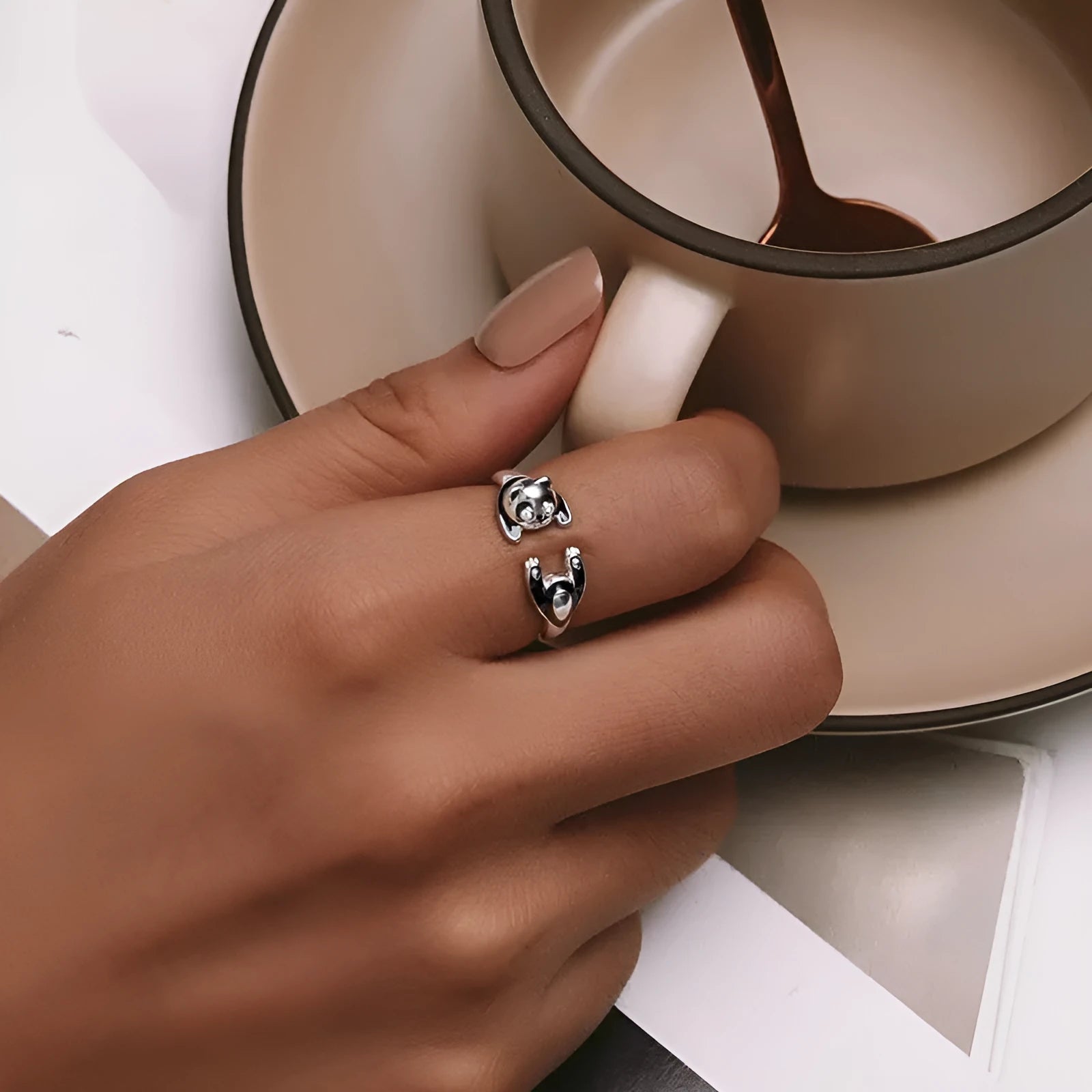 Adjustable sterling silver panda ring bracelet with white gold plating and drip oil finish.
