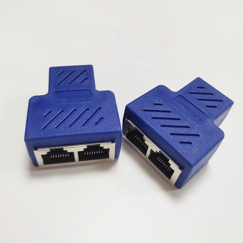 Two white RJ45 network cable splitters showing three female Ethernet ports each.