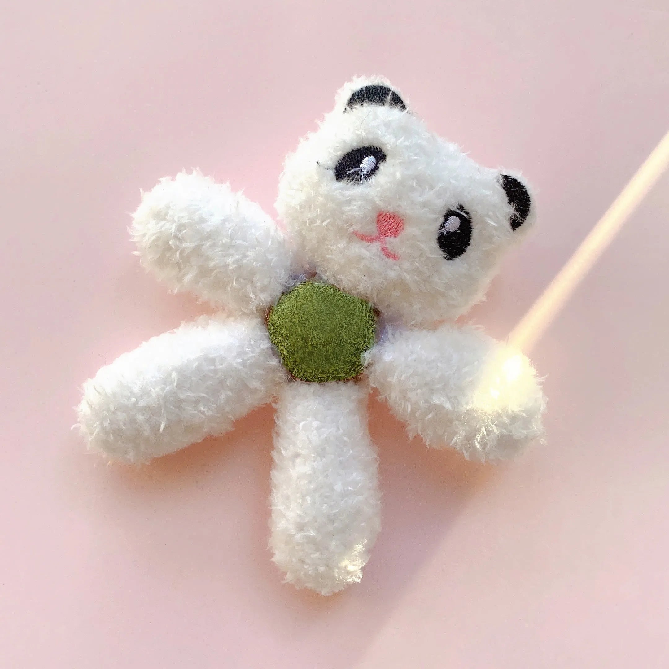 Edible catnip ball chewing toy for cats with plush animal design for dental enrichment