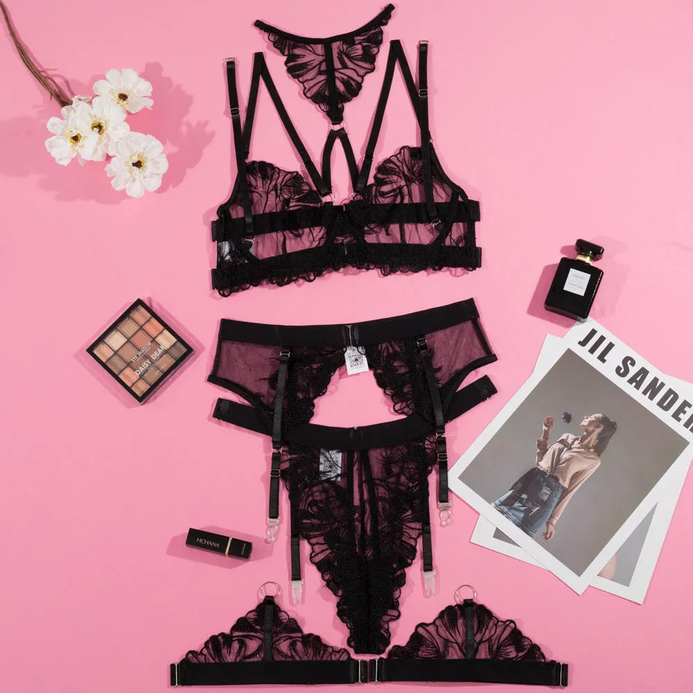Black women's embroidery stitching mesh bikini bra and briefs set on a mannequin.