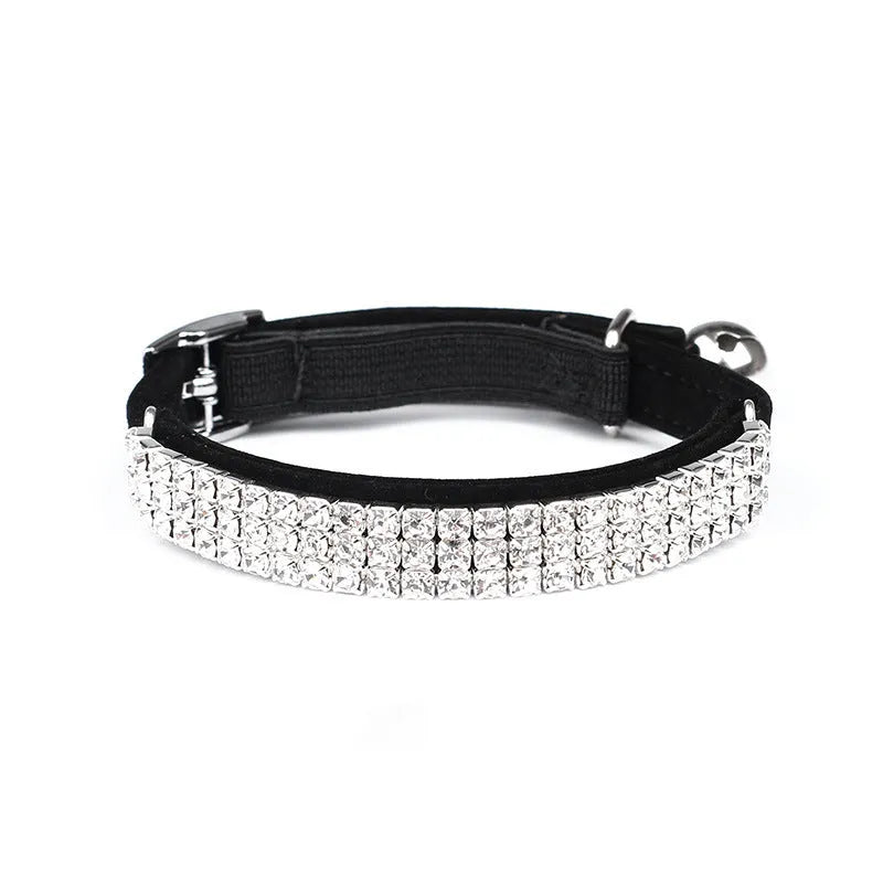 Soft red velvet cat collar with rhinestones, shown adjusted to fit.