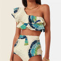 White women's one-shoulder bikini with a large lotus leaf ruffle and high-cut split leg briefs.