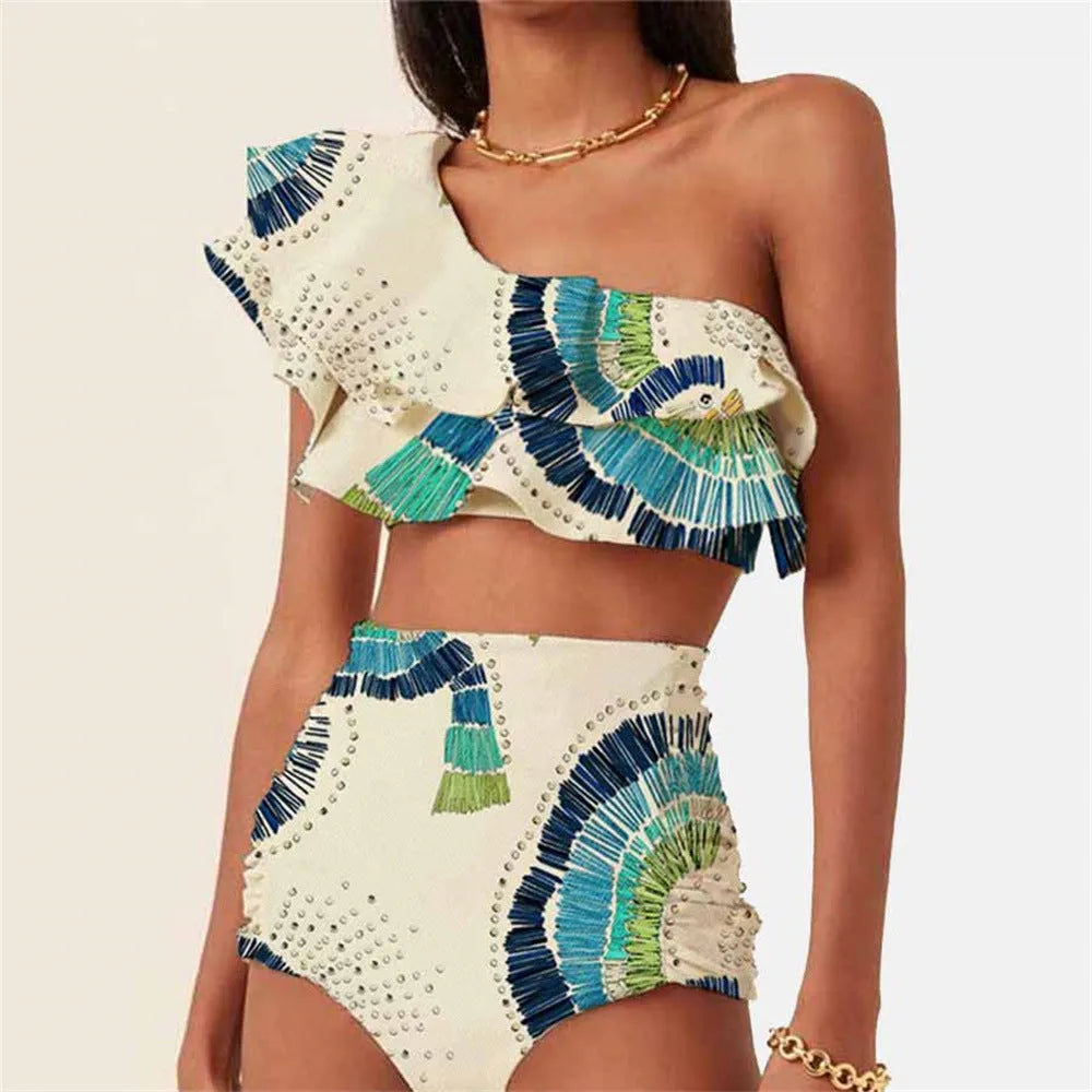 White women's one-shoulder bikini with a large lotus leaf ruffle and high-cut split leg briefs.