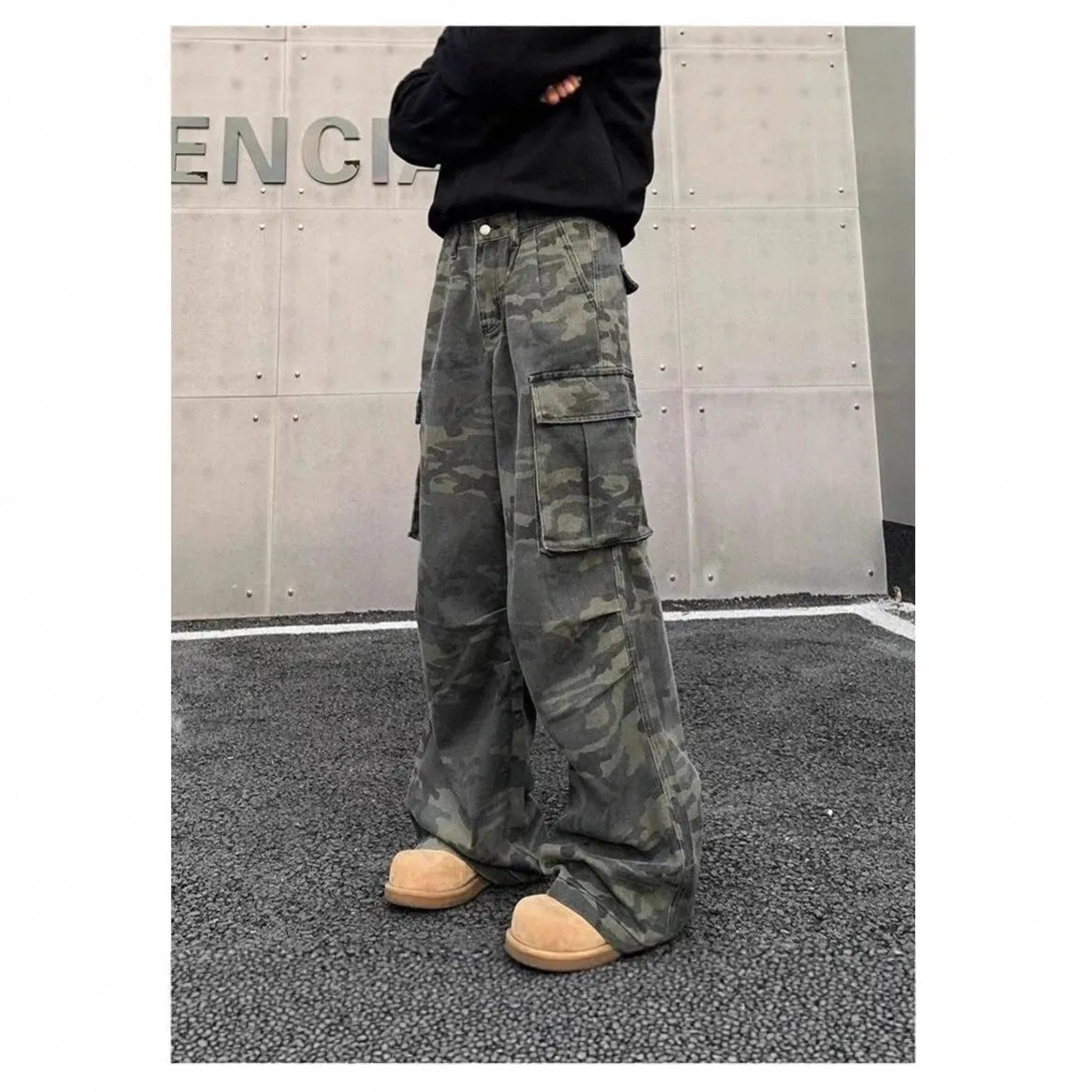 American vintage washed camouflage cargo pants with multiple pockets on a mannequin.