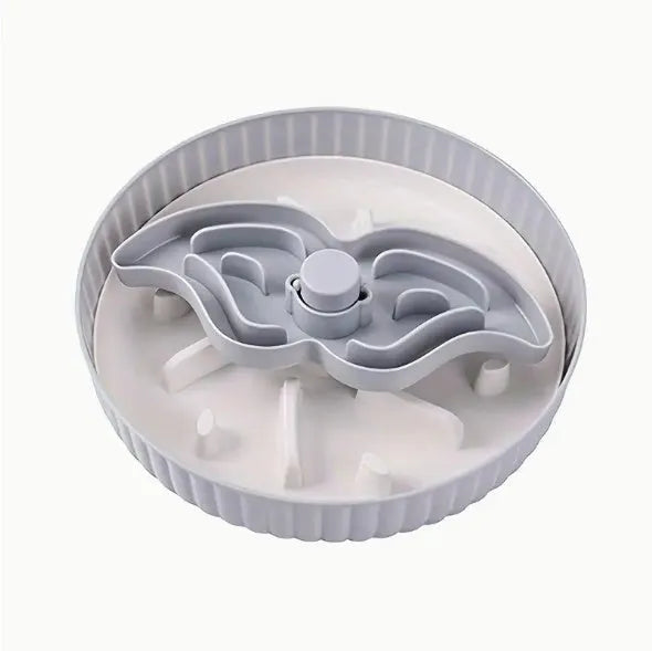 Rotating pet food bowl with silicone slow feeder mat in blue with windmill pattern design