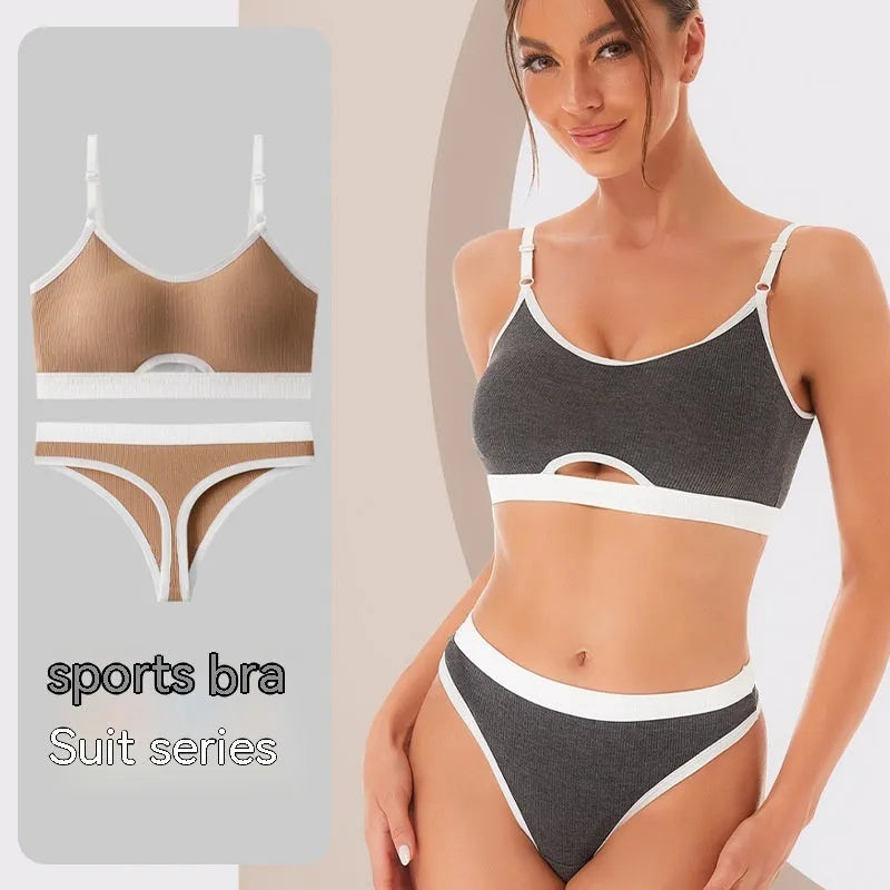 Women's contrast back sports bra vest and briefs set in black with underwire and padding.
