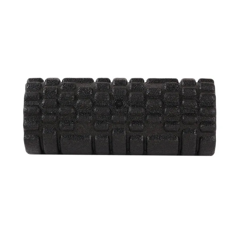 Hollow black EPP foam roller 33x14cm on flat surface for Pilates and balance exercises