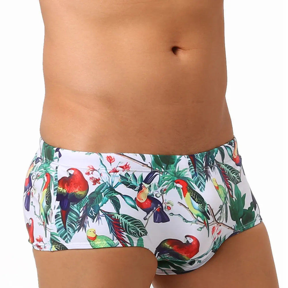 Men's navy swim trunks with white and red flower-bird print pattern, boxer briefs style