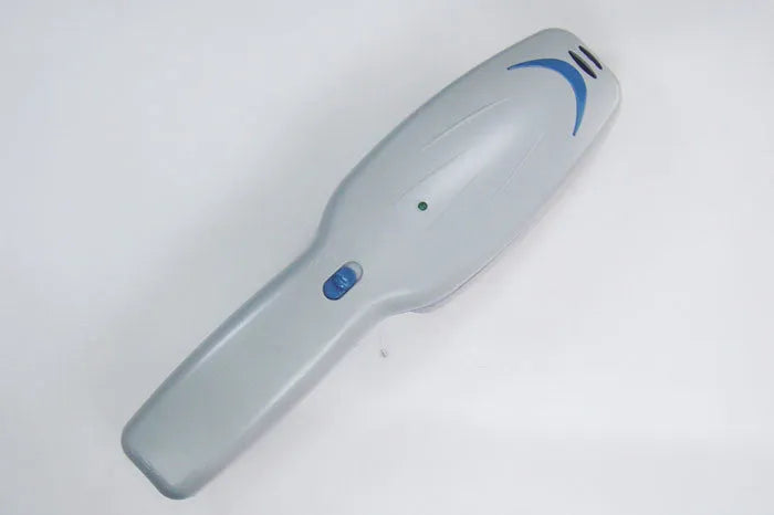 Pet comb with negative ion technology, removable brush head, and 9V battery compartment.