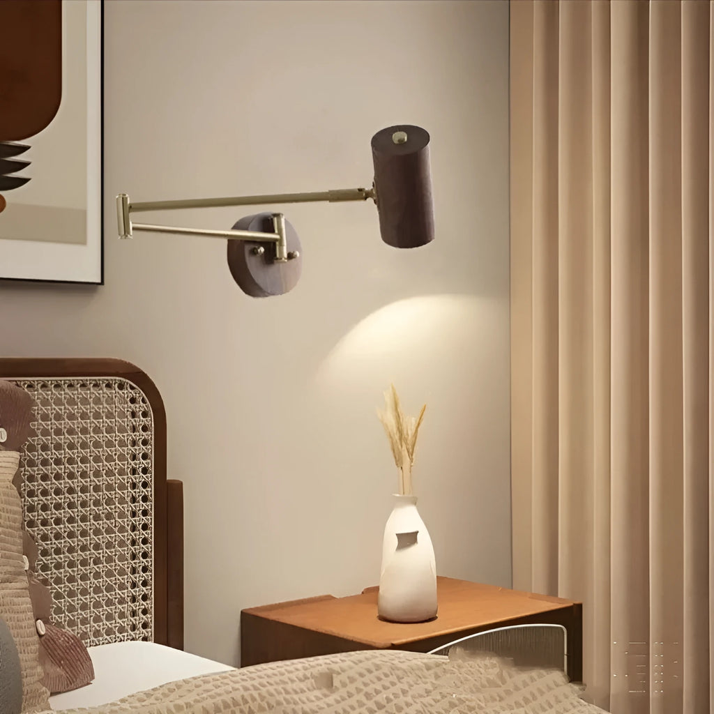 Retro style wall lamp with a long rotating metal arm and a conical shade, shown in a walnut wood finish.