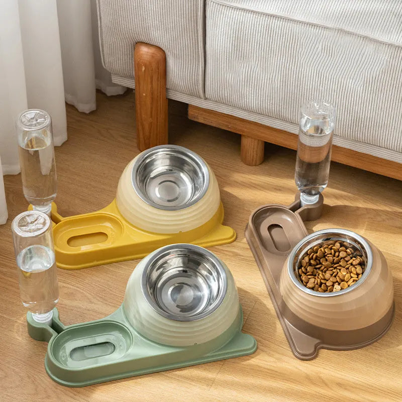 Brown elevated cat food bowl with attached water bottle dispenser on a floor.