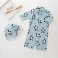 Boys penguin design swimwear set with long sleeves and matching swimming cap