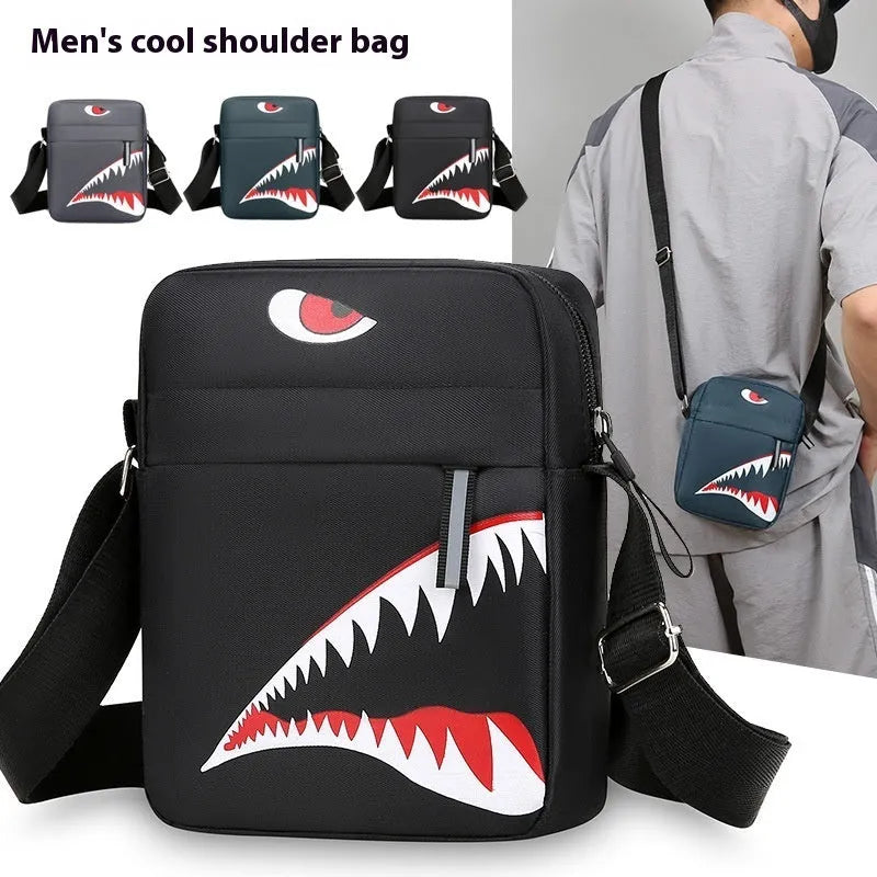 Men's small black Oxford cloth crossbody bag with animal print pattern and shoulder strap.