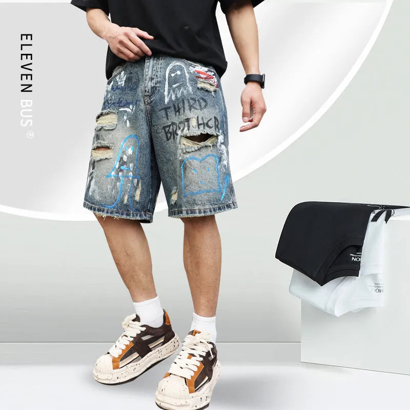 Men's blue ripped denim jeans shorts with graffiti print and straight leg design