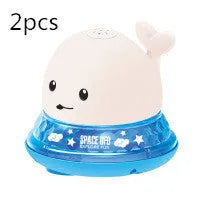 Automatic water spray whale bath toy floating in water with fountain and LED lights