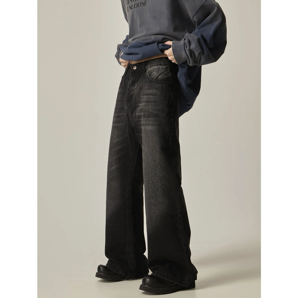 Black straight leg jeans with loose retro styling and basic zip fly design