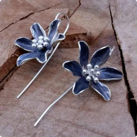 Purple flower-shaped alloy stud earrings with electroplated finish
