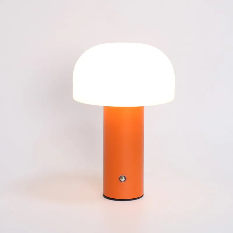 USB table lamp in black, green, orange, or white colours on a desk surface
