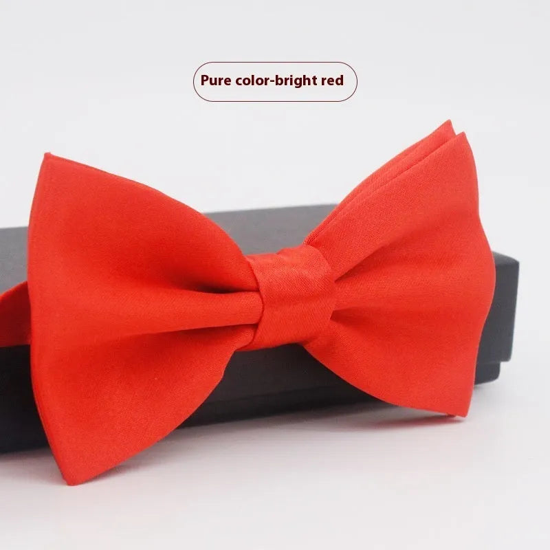 Men's flat head style polyester bow tie in a solid colour, shown with adjustable neck strap.