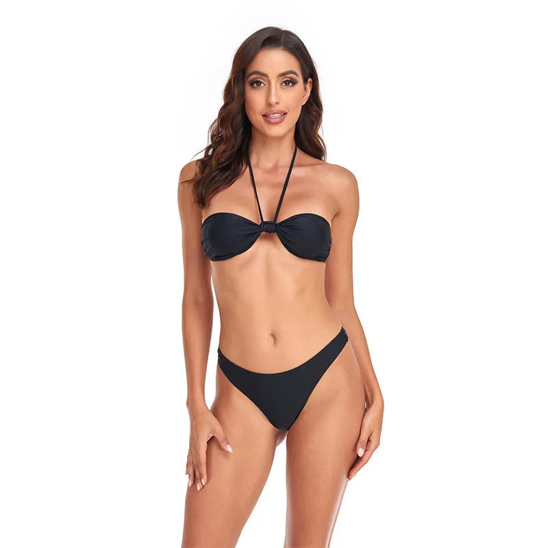 Black women's bikini set with lace-up tube top and matching briefs on swimwear hanger