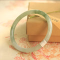 Green jade geometric bracelet with 10mm beads showing traditional Chinese style jewellery